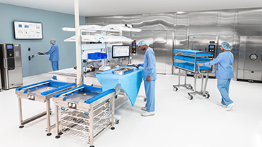 Medical staff working in a sterile equipment processing room