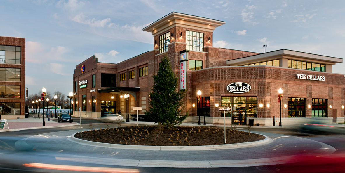 Commercial mixed-use property with retail frontage and street approach